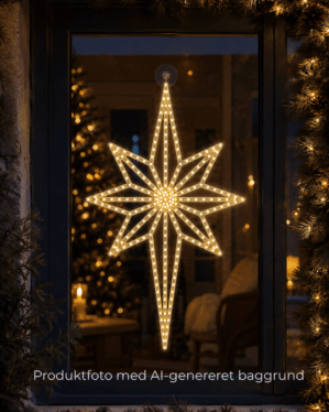 2D julestjerne placeret i et vindue som skaber stemning og hygge.